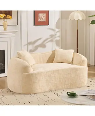 Beige curved two-person compress sofa with armrests and two pillows. Place Order